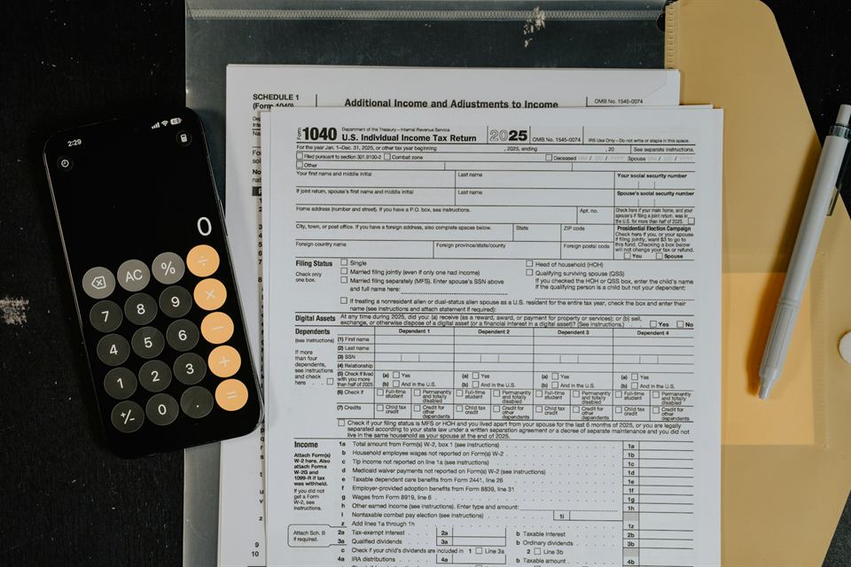 US tax forms next to a calculator