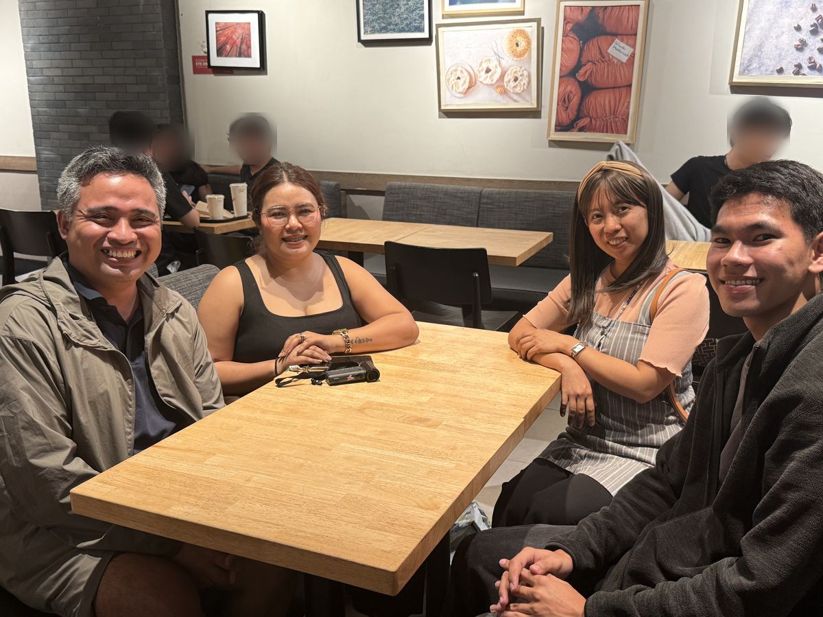 The Bontilebiz team, Jonathan, Shana, Joy and Reggie, smiling around a coffee shop table